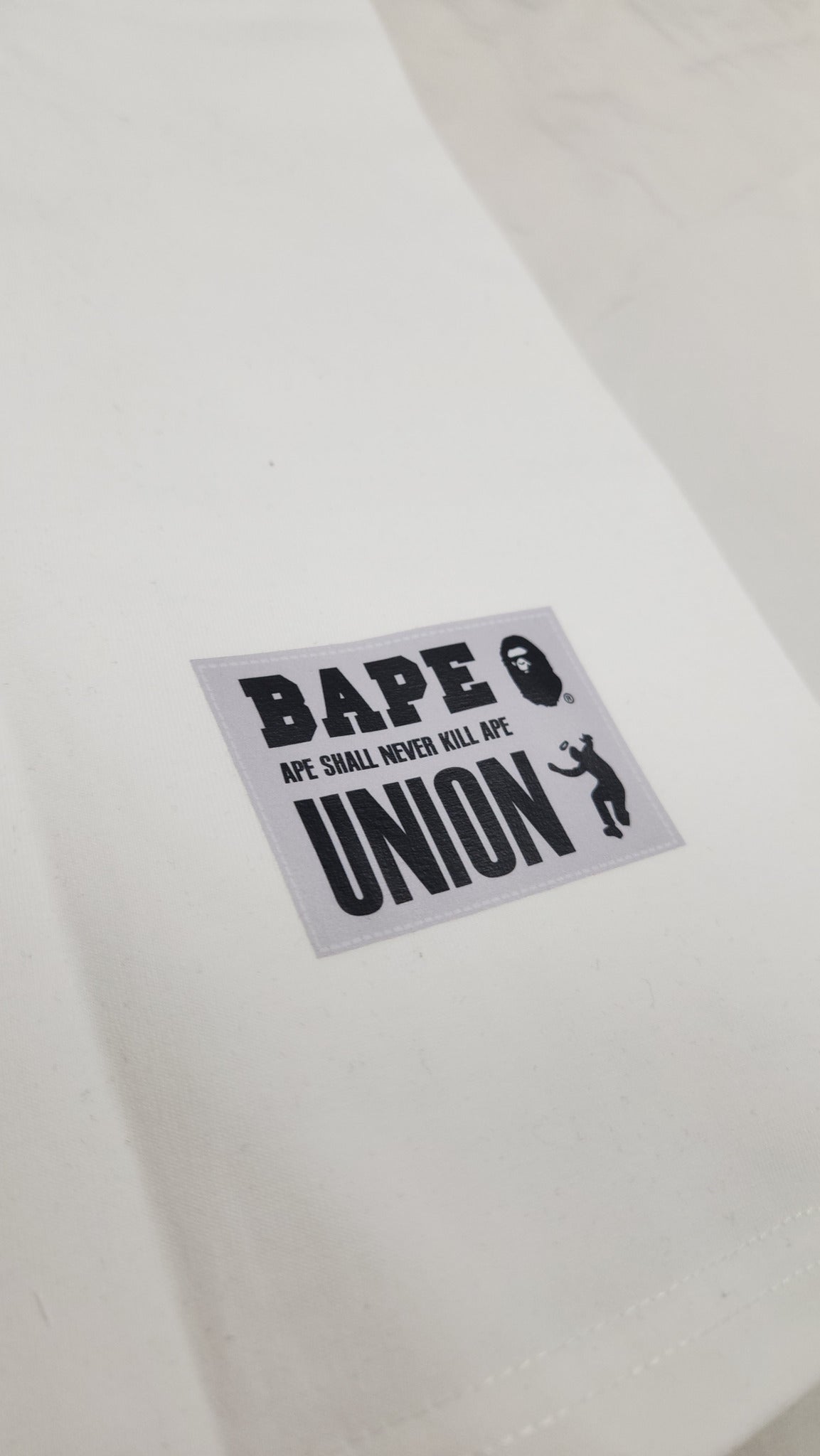 A BATHING APE X UNION PIGMENT DYED APE HEAD TEE